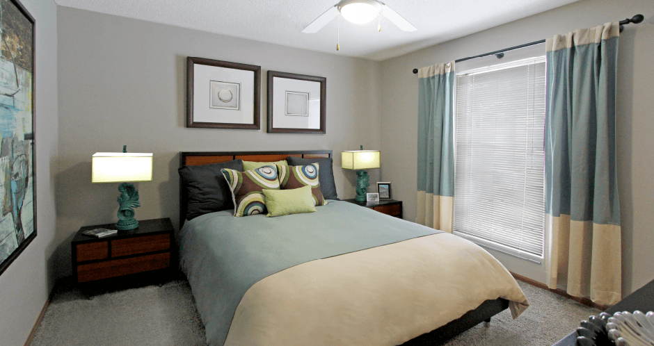 Spacious bedroom with walk-in closet and gray wall color at The Vanderbilt Apartments in Omaha, Nebraska