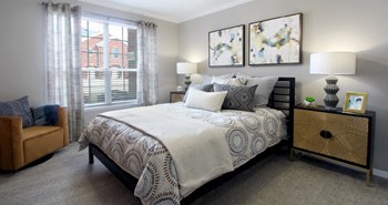 Luxury apartments with spacious bedrooms with attached bathrooms and walk-in closets at Rockledge Oaks Apartments in Lincoln, Nebraska - Photo Gallery 19