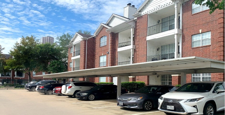 Luxury apartments with brick exteriors, covered parking, private storage, extra storage, at Tuscany Apartments in Houston.