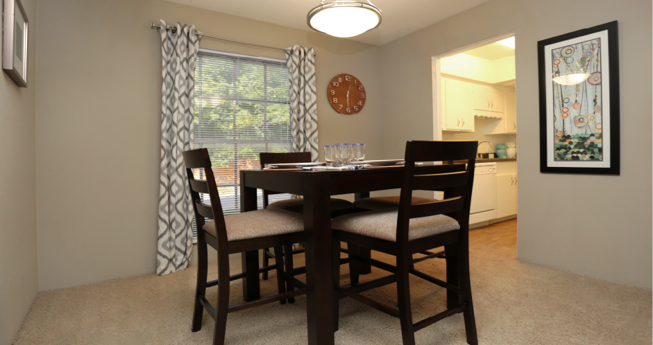 Spacious dining room and bright white kitchens at Plantation apartments in Houston.