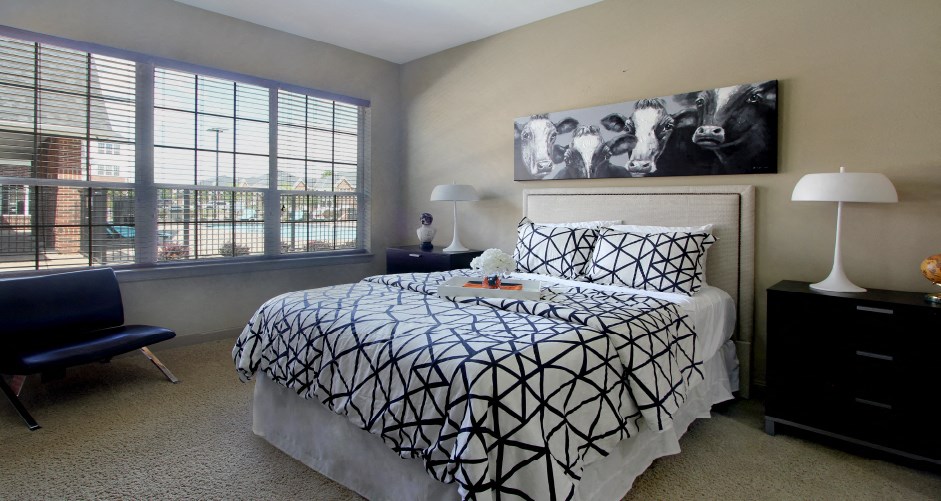 Luxury apartments with master bedroom to fit a king size bed, attached master bathroom and walk-in closet at Bellemeade Apartments in west Des Moines