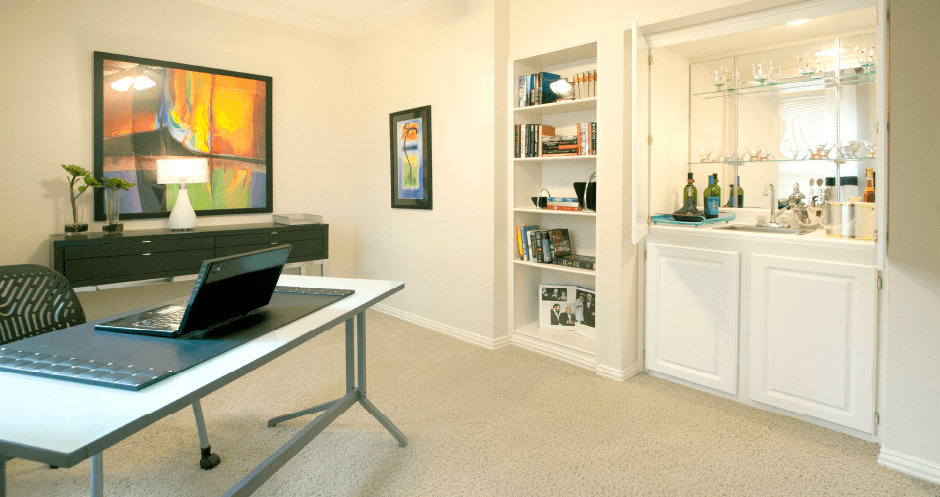 Spacious den or office with wet bar and built-in shelves at The Biltmore Apartments in Omaha, Nebraska
