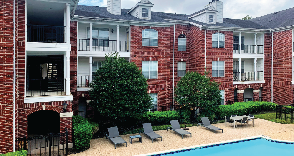 Luxury swimming pool with large sundeck at Tuscany Gate Apartments in Houston.