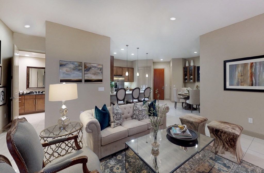 Luxury apartments with spacious living room and dining room with built-in buffet with granite slab top, and 10-foot ceilings at Tuscany Walk Apartments in Houston Texas.
