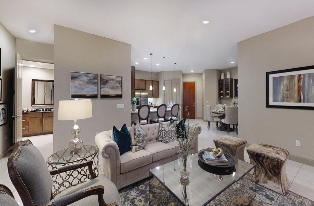 Luxury apartments with spacious living room and dining room with built-in buffet with granite slab top, and 10-foot ceilings at Tuscany Walk Apartments in Houston Texas.