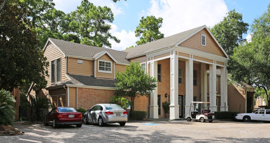 a house with cars parked in front of it
