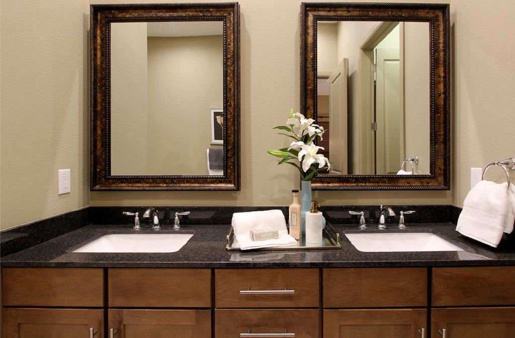 Spacious luxury bath suite with cultured marble vanity with double sinks and double mirrors Tuscany Walk Apartments in Houston