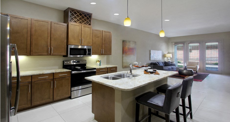 Luxury apartments with spacious open floor plan, granite countertops, stainless steel appliances, porcelain tile floors, and oversized windows at Bellemeade Apartments in west Des Moines