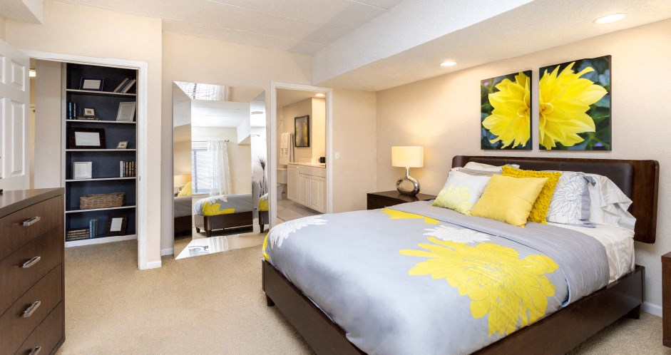 Huge master bedroom with attached walk-in closet and master bathroom, built-in shelves, spacious master bedroom at Embassy Park Apartments in Omaha, Nebraska