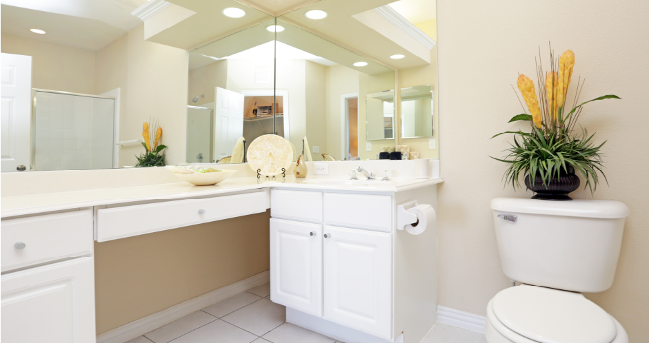 Luxury apartments with spacious bathrooms with tiled floors, oval soaking tubs, built-in vanity, cultured marble vanity, glass shower and white cabinets in at Saddlebrook apartments in Urbandale Iowa