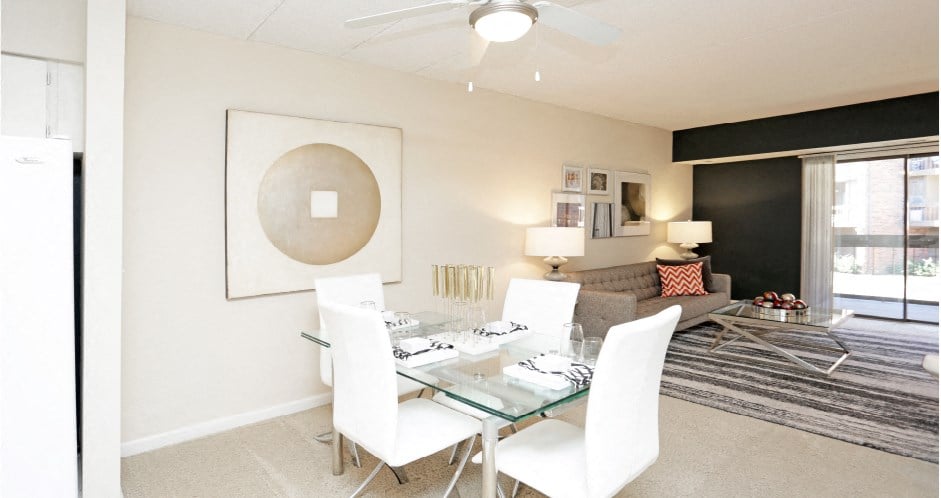 Spacious living room with colored feature wall at Embassy Park Apartments in Omaha, Nebraska
