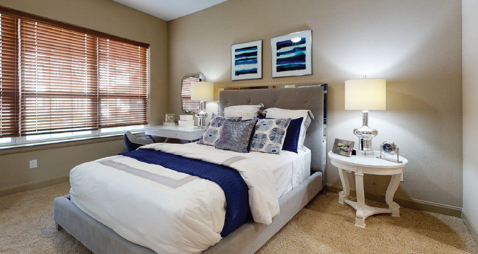 Luxury apartments with master bedroom to fit a king size bed, attached master bathroom and walk-in closet at Bellemeade Apartments in west Des Moines