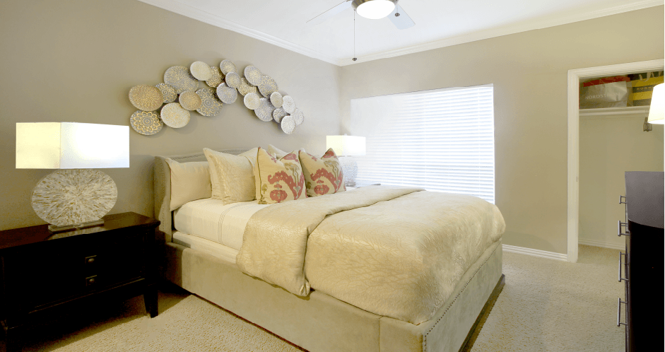 Luxury apartments with spacious bedrooms that can fit a king-size bed with attached bathrooms and walk-in closets at The Dorchester Apartments in north Dallas.