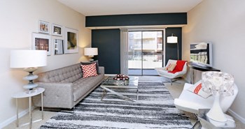 Spacious living room with colored feature wall at Embassy Park Apartments in Omaha, Nebraska - Photo Gallery 25