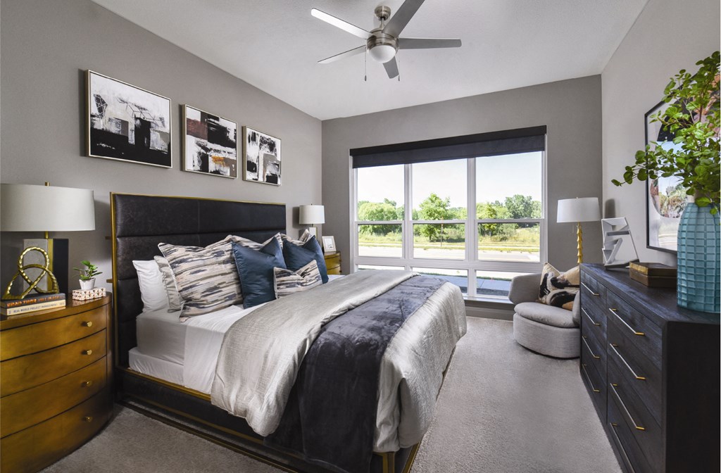 Luxury apartments with master bedroom to fit a king size bed, attached master bathroom and walk-in closet at Xenia Apartments in Golden Valley, Minnesota