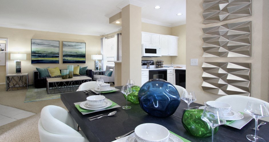 Luxury apartments with spacious dining room, oversized windows, and plank wood floors at TurtleCreek apartments in West Des Moines, Iowa