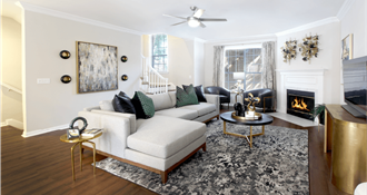 Spacious living room with wood-burning fireplace, huge living room at Tuscany Row Townhomes in Houston.