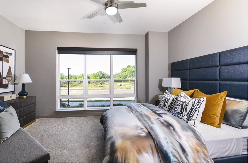 Luxury apartments with master bedroom to fit a king size bed, attached master bathroom and walk-in closet at Xenia Apartments in Golden Valley, Minnesota