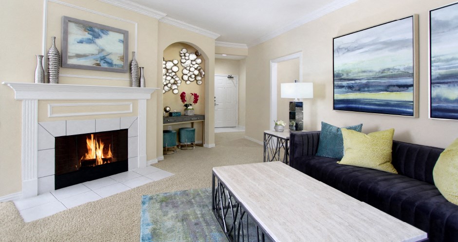 Luxury apartments with spacious open floor plan, woodburning fireplace, and oversized windows at Saddlebrook apartments in Urbandale, Iowa