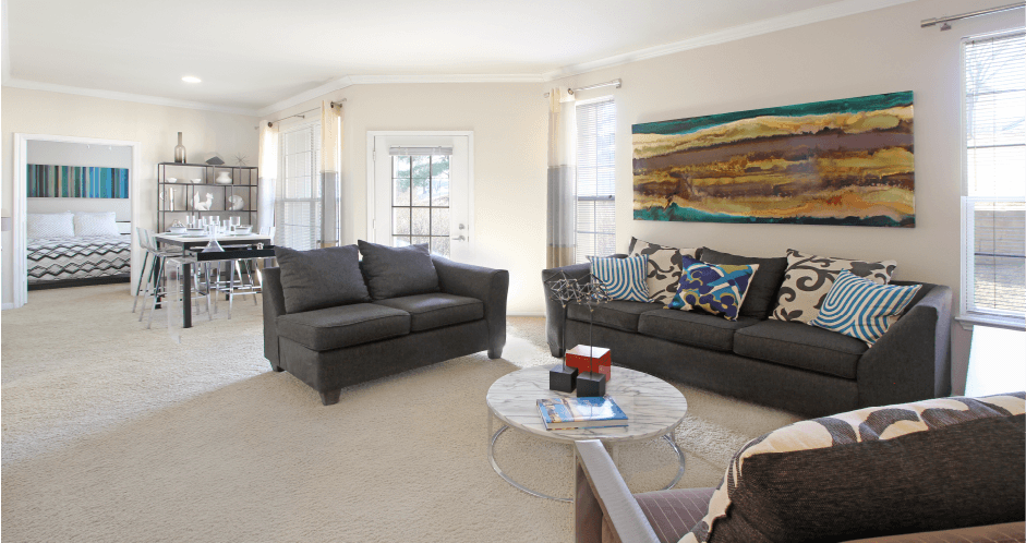 Apartments in southwest Omaha with open floor plan, open layout, spacious apartment, spacious living room, spacious dining room, lots of natural light, and oversized windows at Breckenridge Apartments in Omaha, Nebraska