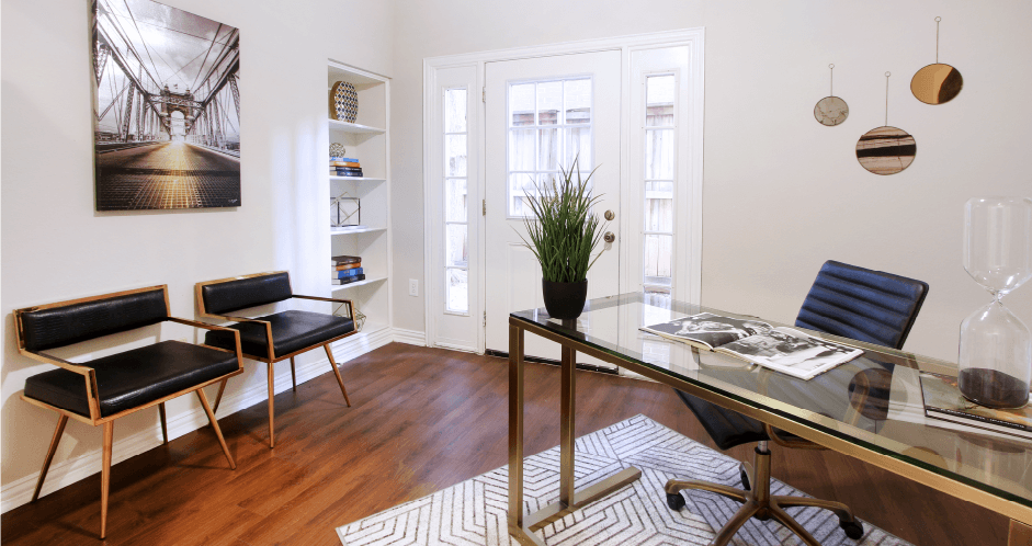 Huge office space, spacious den with built-in shelves, hardwood floors, and private backyard patio at Tuscany Villas Townhomes in Houston.