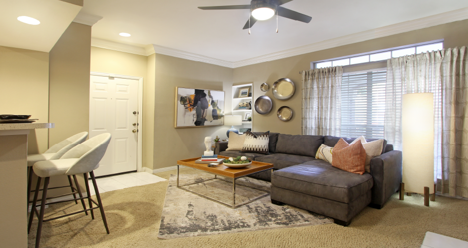 Spacious apartments with oversized windows, wood burning fireplaces, breakfast bar, and built-in shelves at The Dorchester Apartments in Houston.