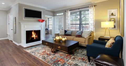 a living room with a fireplace and a couch