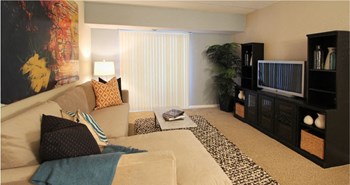 Spacious living room with colored feature wall at Embassy Park Apartments in Omaha, Nebraska - Photo Gallery 19