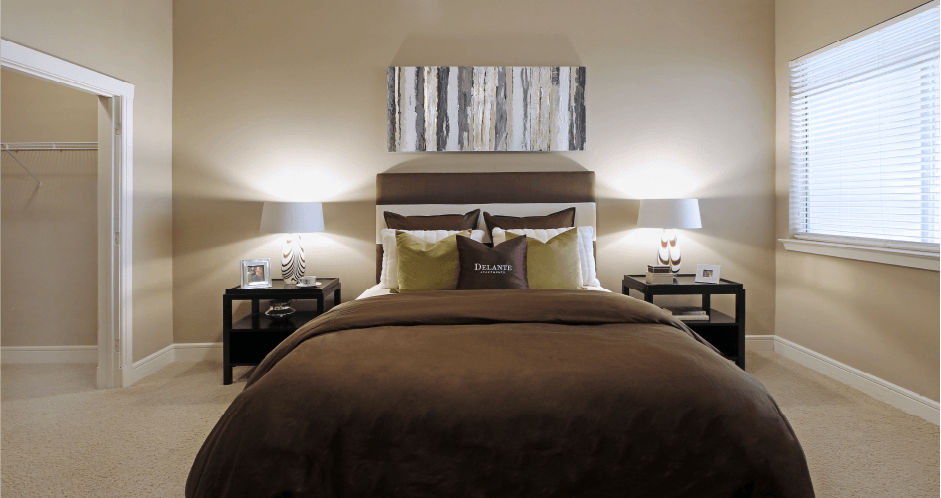 Master bedroom with spacious walk-in closet at Delante Apartments in Irving Texas