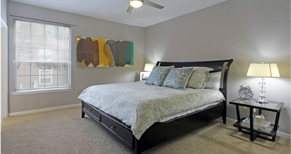Huge master bedroom with walk-in closet, gray wall color, and luxury master bathroom at Breckenridge Apartments in Omaha, Nebraska