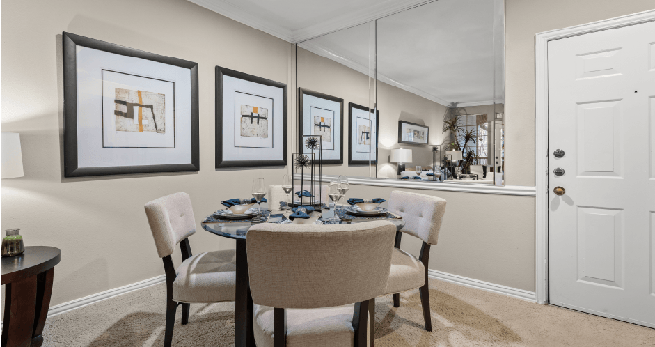 Luxury apartments with gray colored walls and mirror accent wall at The Saxony Apartments