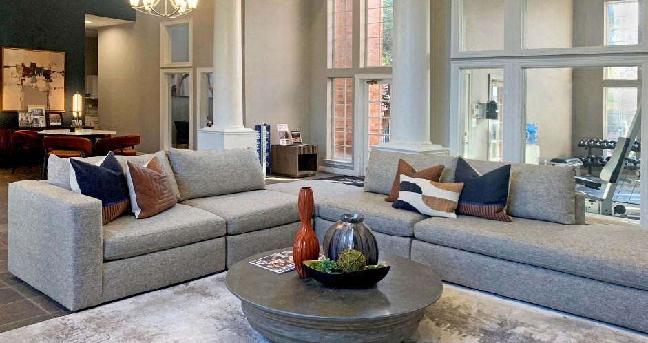 a living room with couches and a coffee table