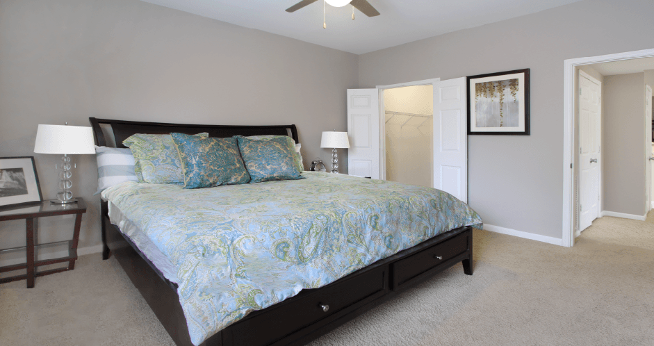 Huge master bedroom with walk-in closet, gray wall color, and luxury master bathroom at Breckenridge Apartments in Omaha, Nebraska