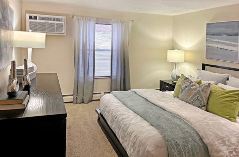 Master bedroom with walk-in closet and 9-foot ceilings at Claremont Apartments in Minnetonka, Minnesota