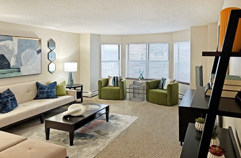Spacious living room with huge windows and lots of natural light at Claremont Apartments in Minnetonka Minnesota