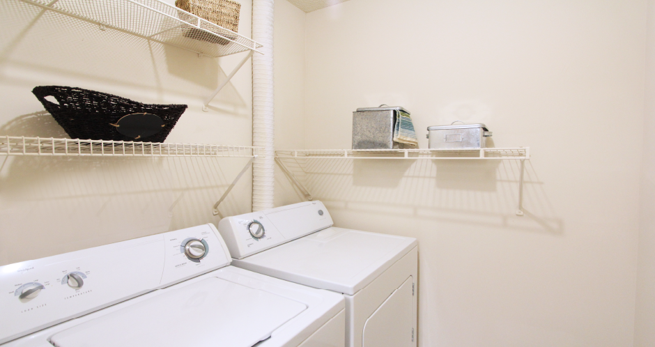 Apartments with laundry room and full-size washer and dryer at the Vanderbilt Apartments in central Omaha, Nebraska