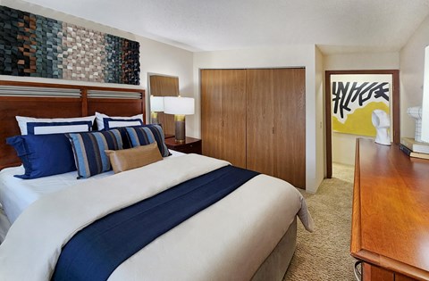 Master bedroom with walk-in closet and 9-foot ceilings at Claremont Apartments in Minnetonka, Minnesota