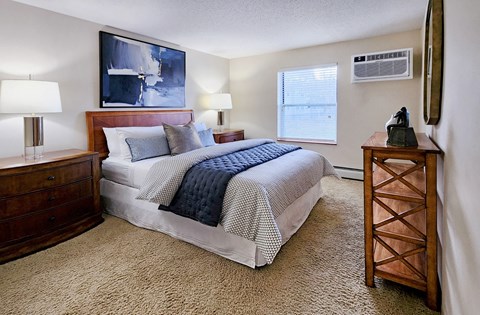 Master bedroom with walk-in closet and 9-foot ceilings at Claremont Apartments in Minnetonka, Minnesota