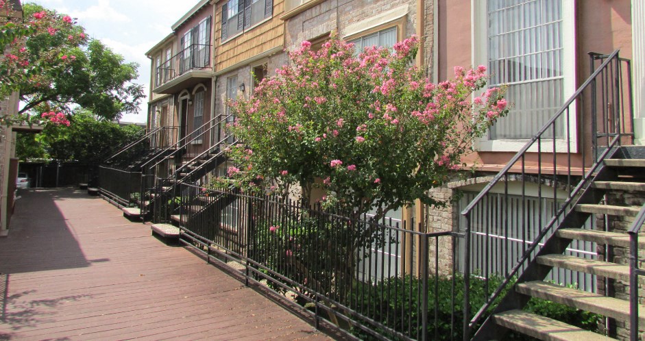 Beautiful unique townhome community near the Galleria within walking distance of shops, restaurants, and entertainment at Briarwood Apartments in Houston.