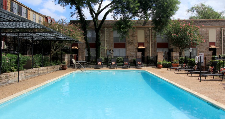 Townhome community with 4 swimming pools, beautiful landscaping, unique townhome community with a small community feel at Briarwood Apartments in Houston.