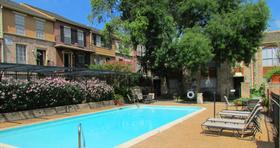 Townhome community with 4 swimming pools, beautiful landscaping, unique townhome community with a small community feel at Briarwood Apartments in Houston.