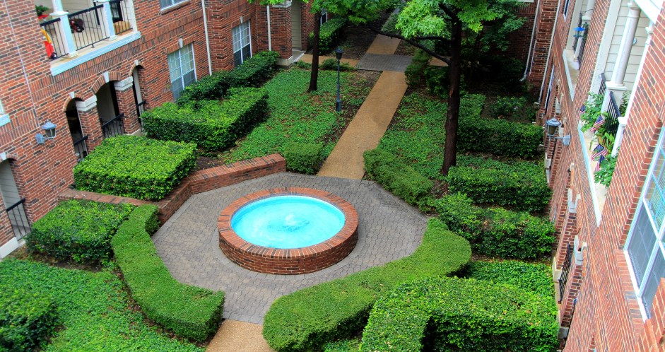 Gated apartment community near the Galleria with landscaped courtyards, beautiful landscaping, and beautiful courtyards with fountains.