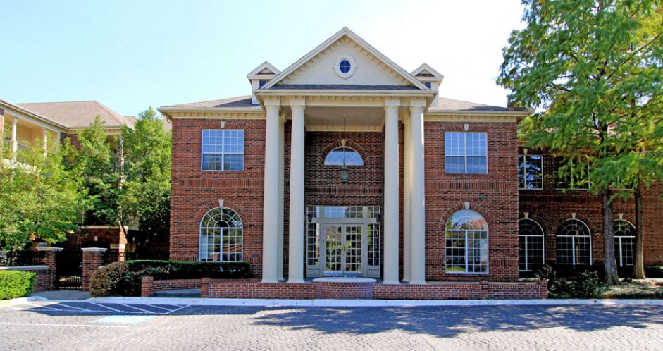 Gated community near the Galleria with brick exteriors, covered parking, and detached garages.