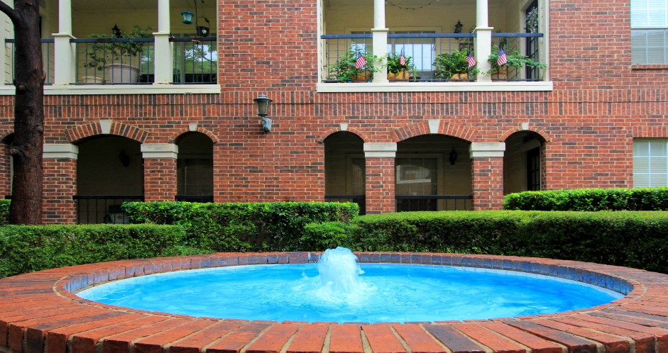 Gated apartment community near the Galleria with landscaped courtyards, beautiful landscaping, and beautiful courtyards with fountains.