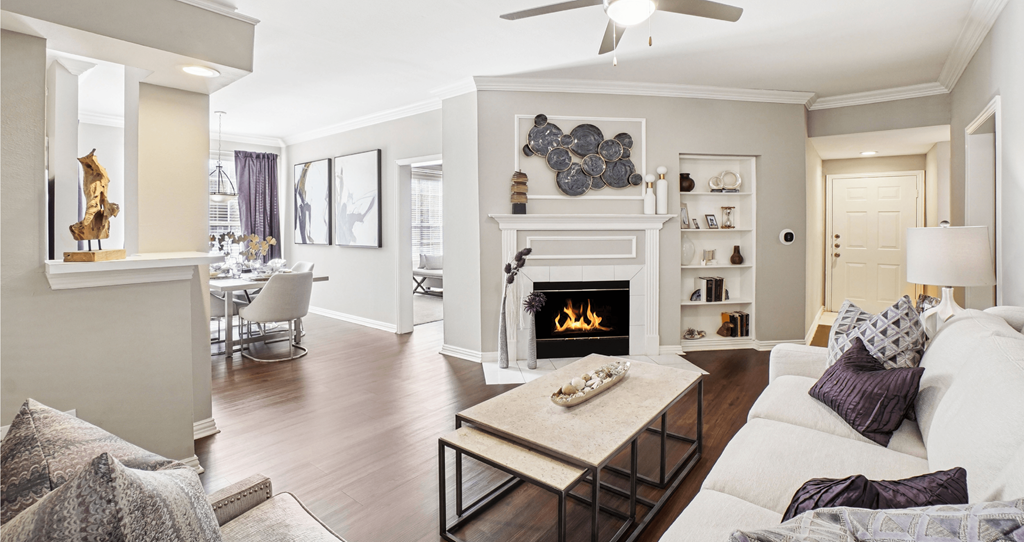 A living room with a fireplace and a couch.