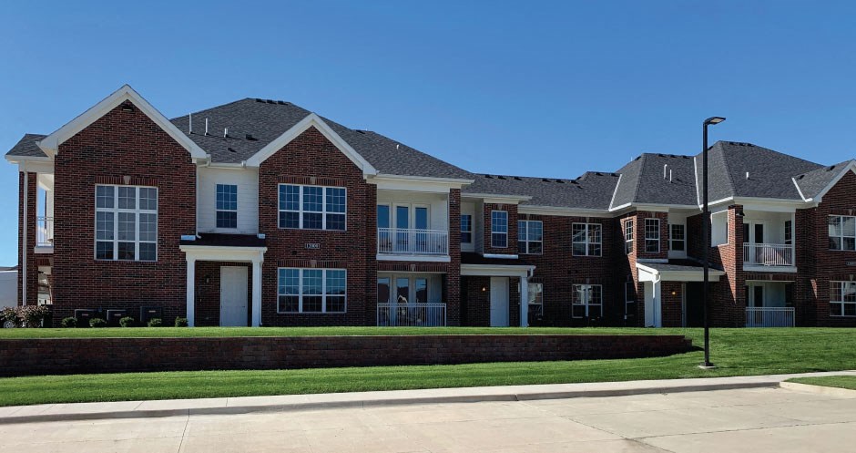 Luxury townhomes with attached garages, scenic views and red brick exteriors at Bellemeade Apartments in west Des Moines