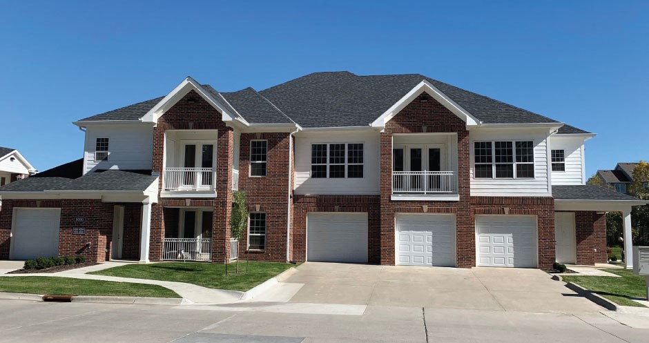Luxury townhomes with attached garages, scenic views and red brick exteriors at Bellemeade Apartments in west Des Moines