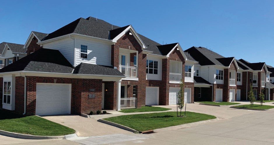 Luxury townhomes with attached garages, scenic views and red brick exteriors at Bellemeade Apartments in west Des Moines