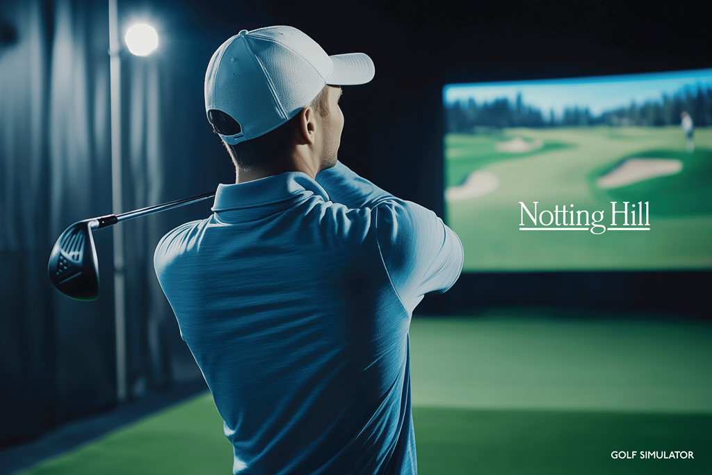 A man is playing golf in front of a screen showing a golf course.