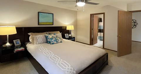 Spacious bedroom with walk-in closet and attached bathroom at LionsHead Apartments in Omaha Nebraska